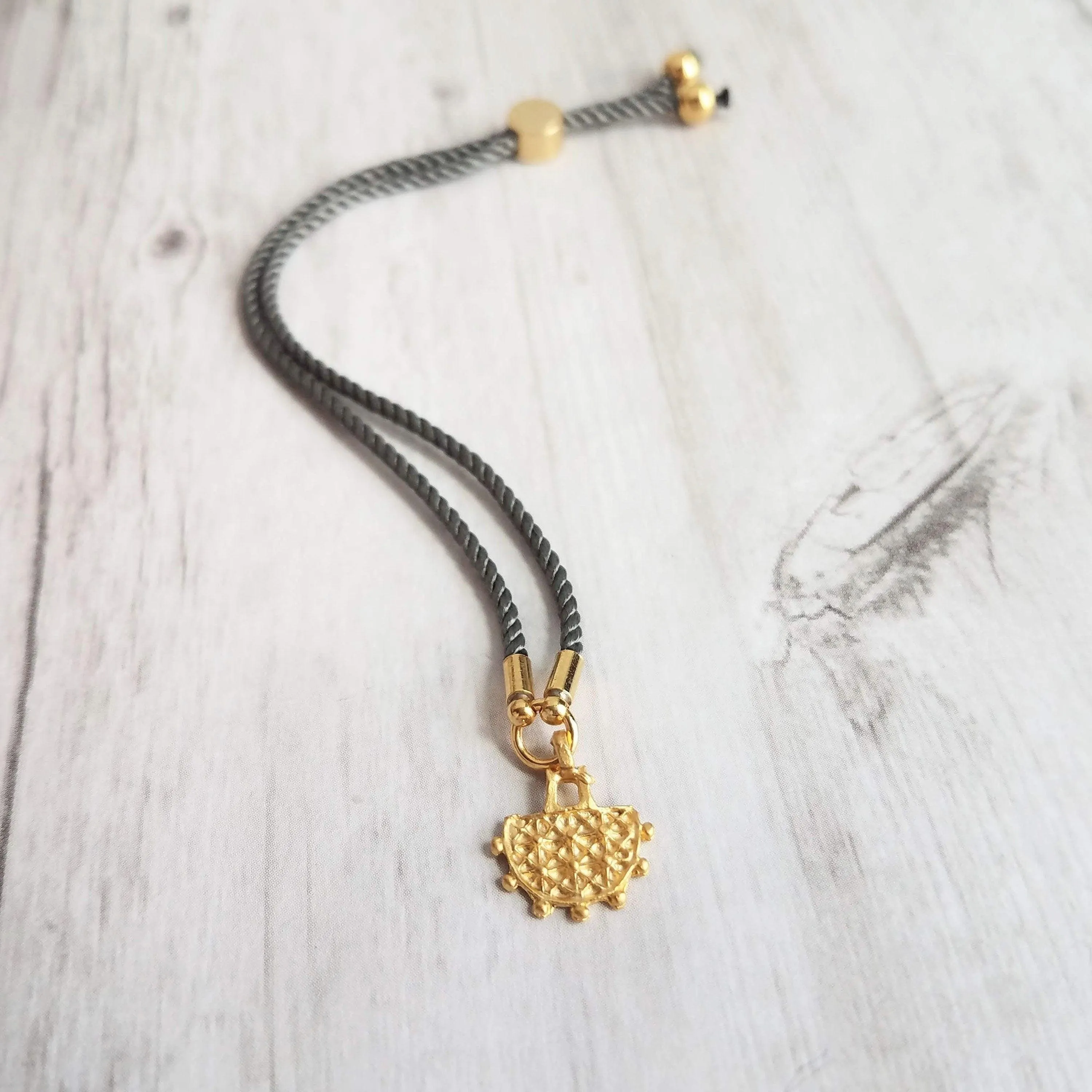 Cord Bracelet - grey silk style thin twisted rope - gold semicircle medallion charm - adjustable /one size fits most - gray stacking layer