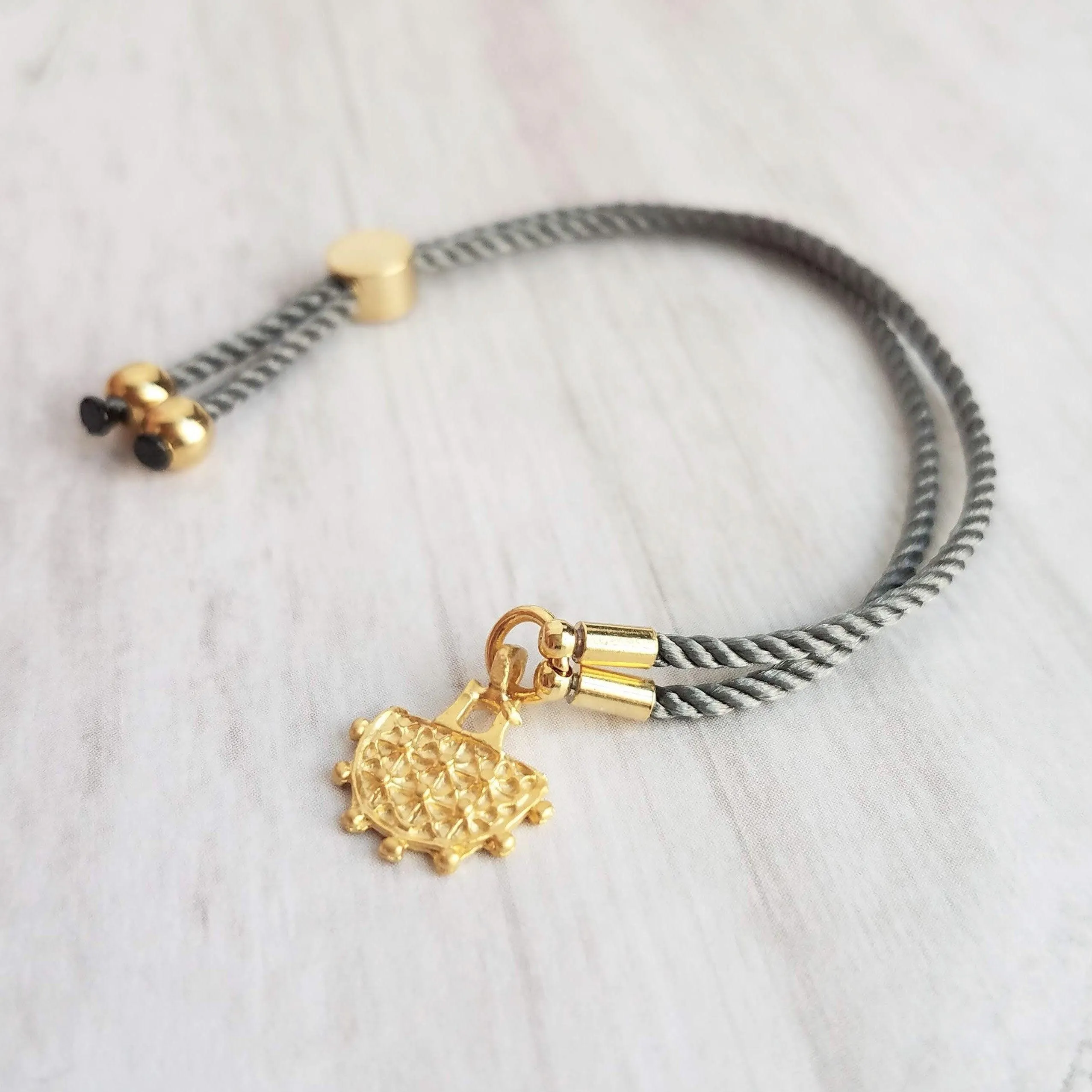 Cord Bracelet - grey silk style thin twisted rope - gold semicircle medallion charm - adjustable /one size fits most - gray stacking layer