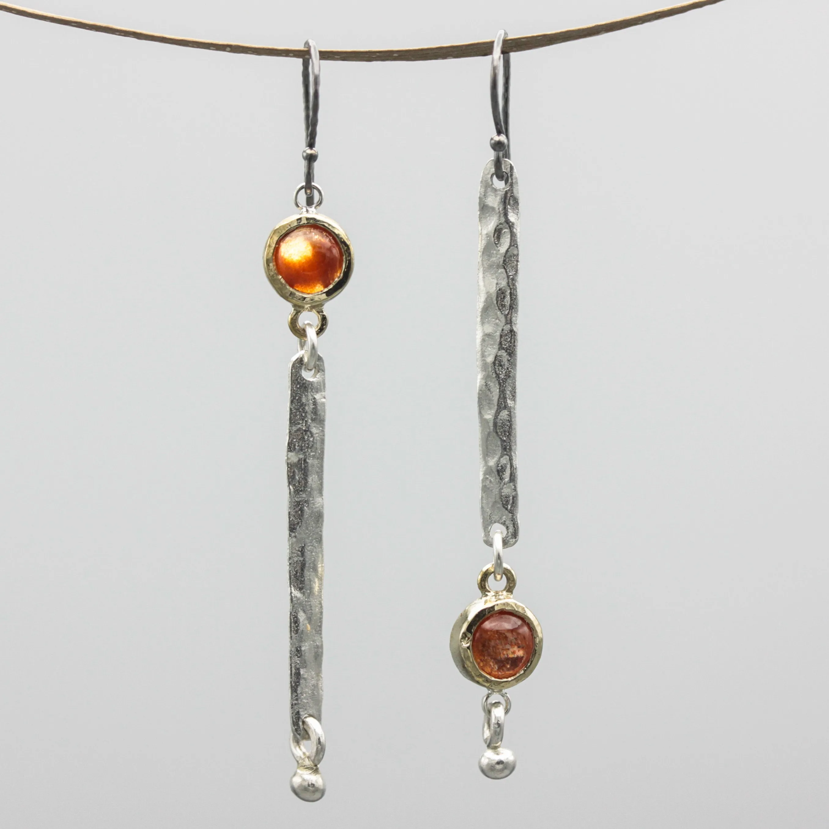 Round Sunstone earrings in brass bezel setting with silver bar hammer textured on sterling silver hooks style