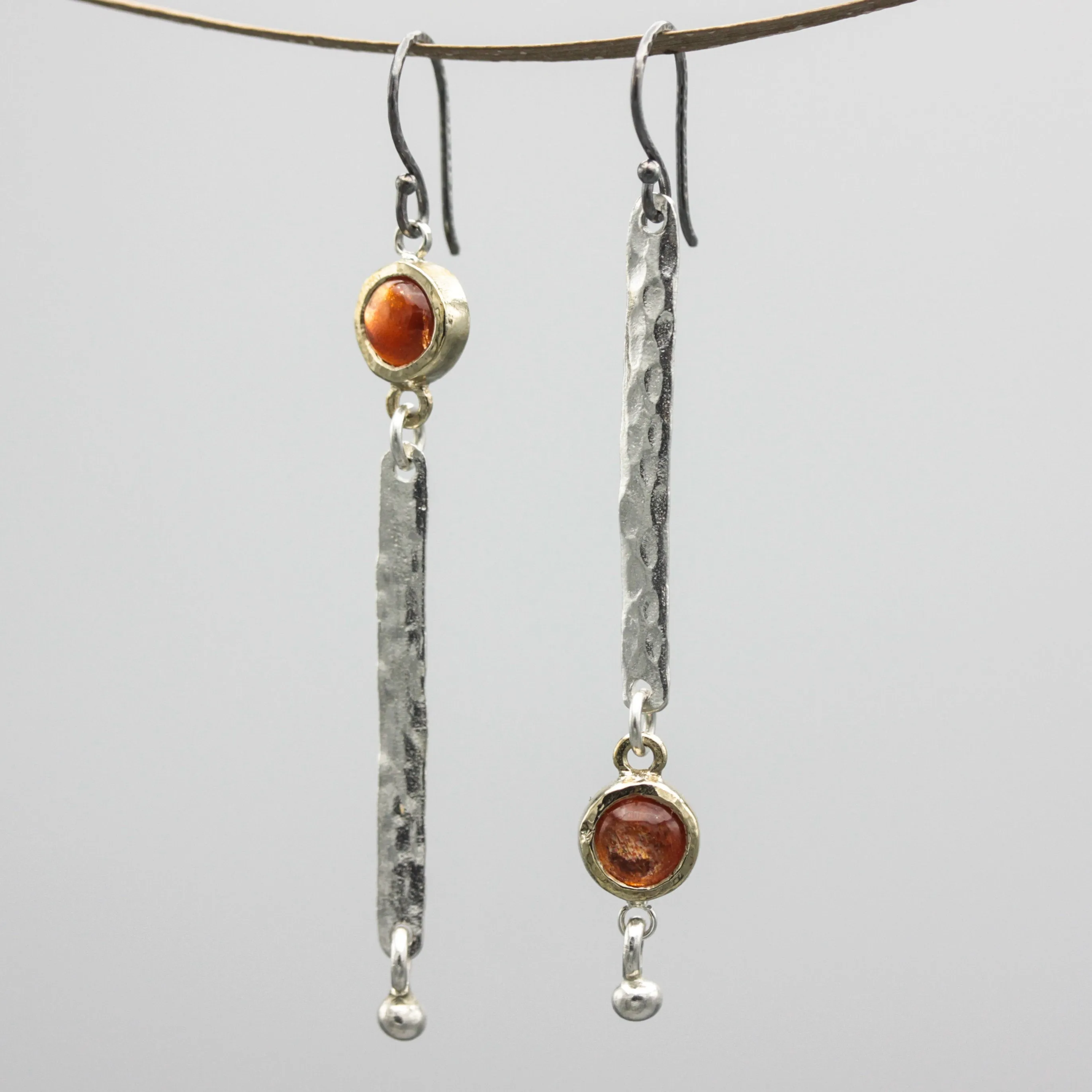 Round Sunstone earrings in brass bezel setting with silver bar hammer textured on sterling silver hooks style